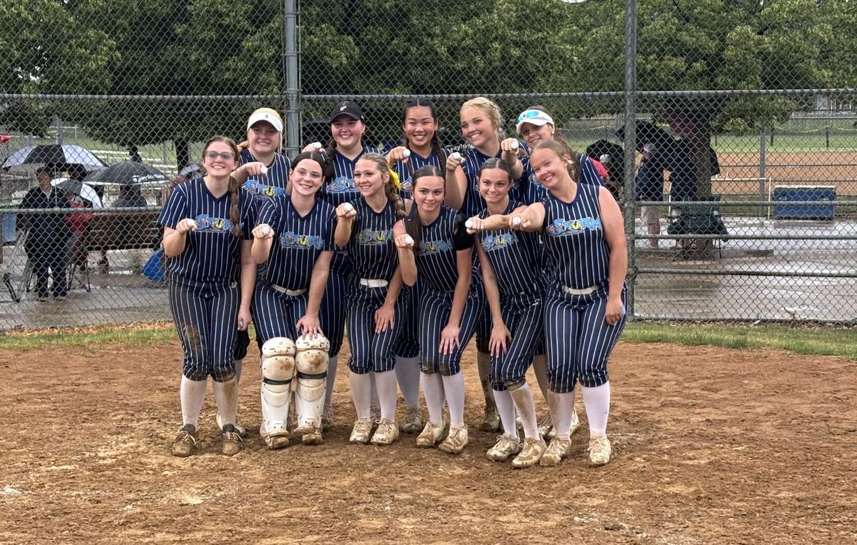 Storm 18U team showing championship rings